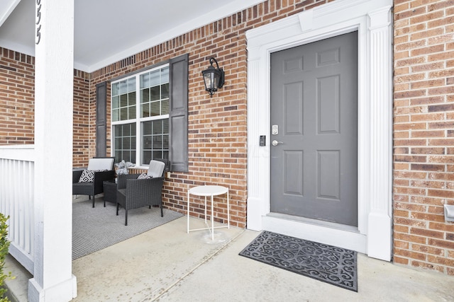 entrance to property featuring a porch