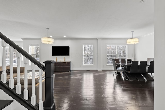 dining space featuring crown molding