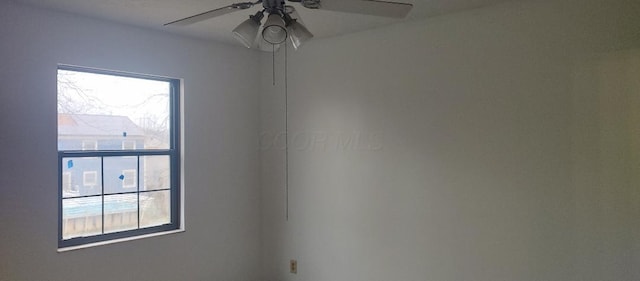 unfurnished room with ceiling fan