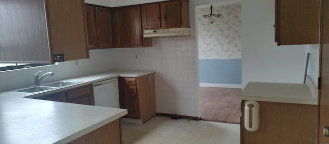 kitchen with white dishwasher and sink