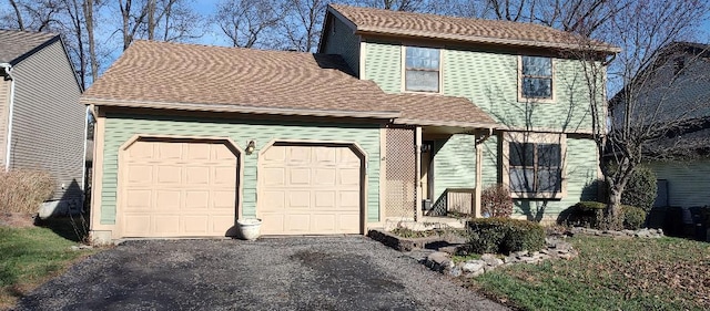 front of property with a garage