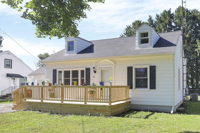 cape cod house with a front yard and cooling unit