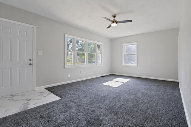 carpeted empty room with ceiling fan