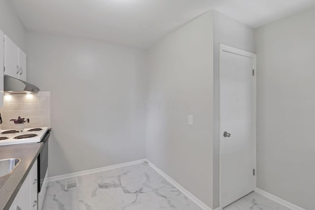 kitchen featuring white cabinets, decorative backsplash, white range with electric stovetop, and sink