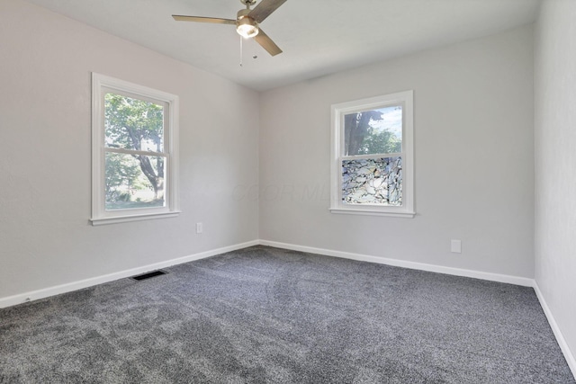 carpeted empty room featuring ceiling fan