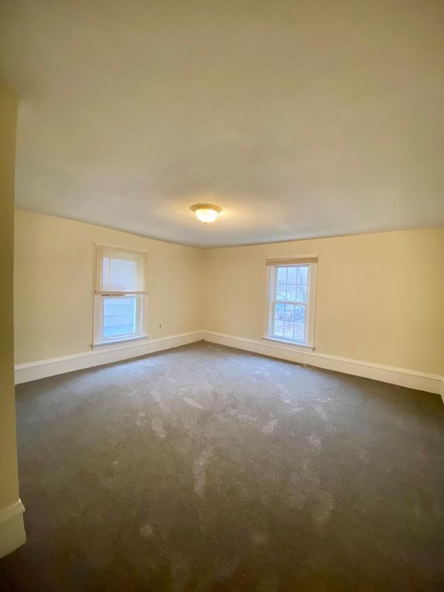 empty room featuring carpet floors