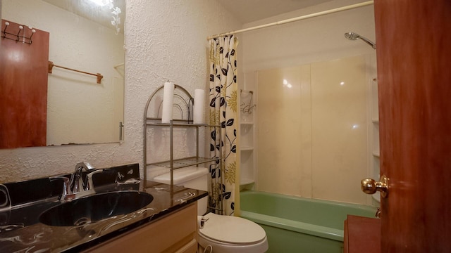 full bathroom with vanity, shower / bath combination with curtain, and toilet