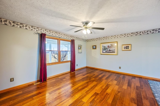 spare room featuring ceiling fan, hardwood / wood-style floors, and a textured ceiling