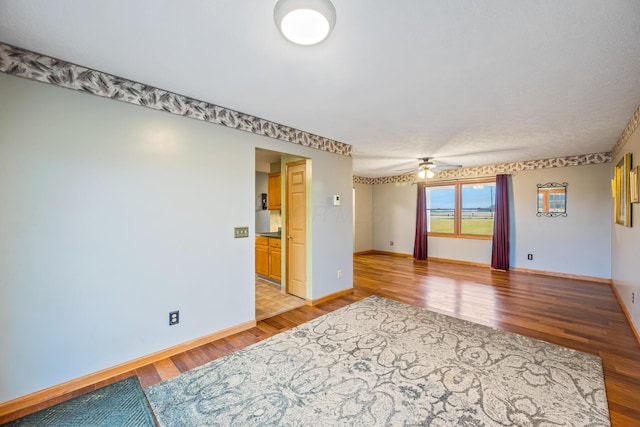 unfurnished room featuring ceiling fan and light hardwood / wood-style floors