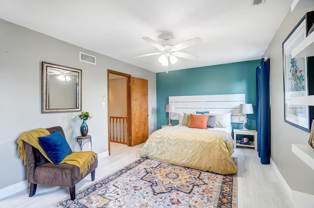 bedroom featuring ceiling fan and light wood-type flooring