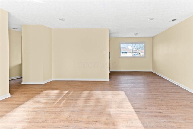 unfurnished room featuring light hardwood / wood-style flooring