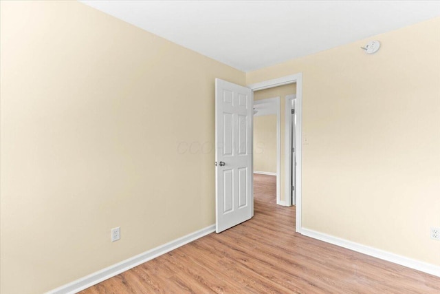 spare room featuring light wood-type flooring