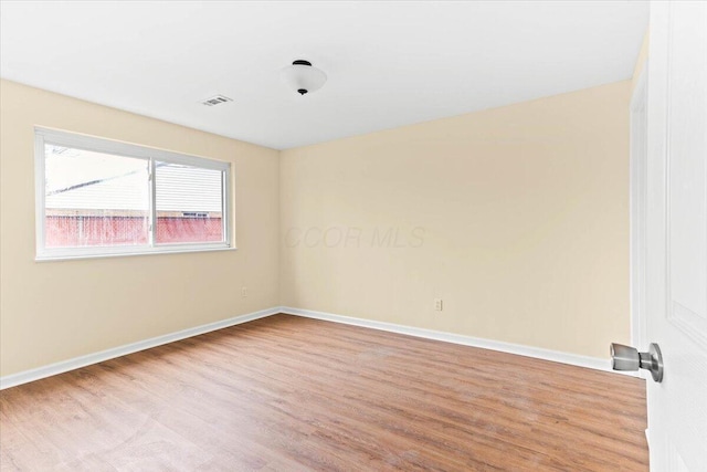 empty room with light wood-type flooring