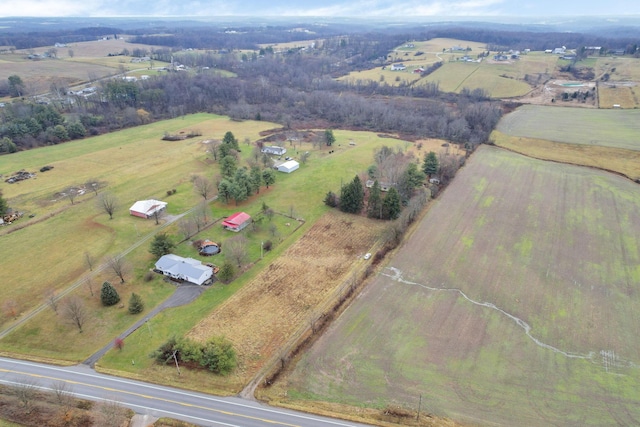 birds eye view of property featuring a rural view