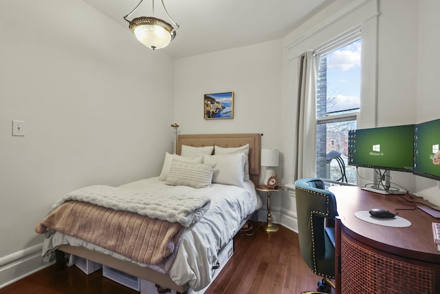 bedroom featuring dark wood-type flooring