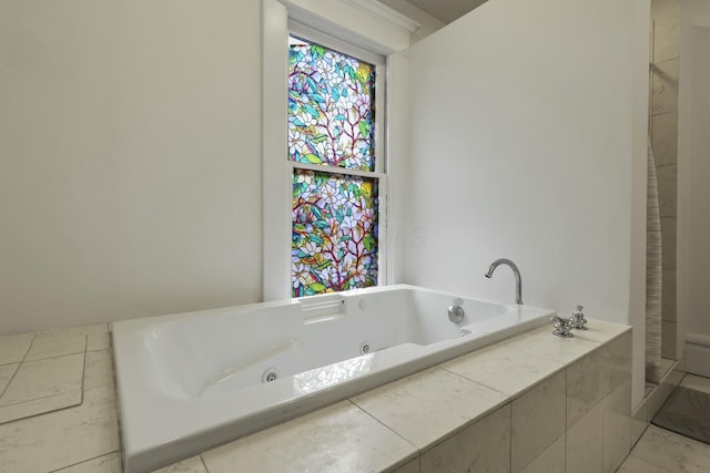 bathroom featuring tiled bath