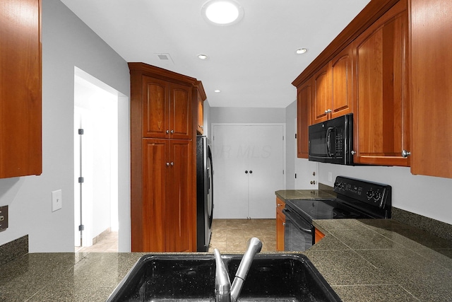 kitchen with black appliances and sink