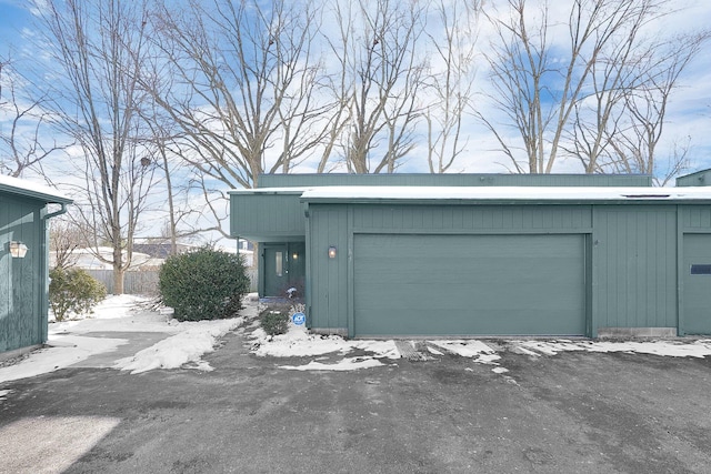 view of snow covered garage