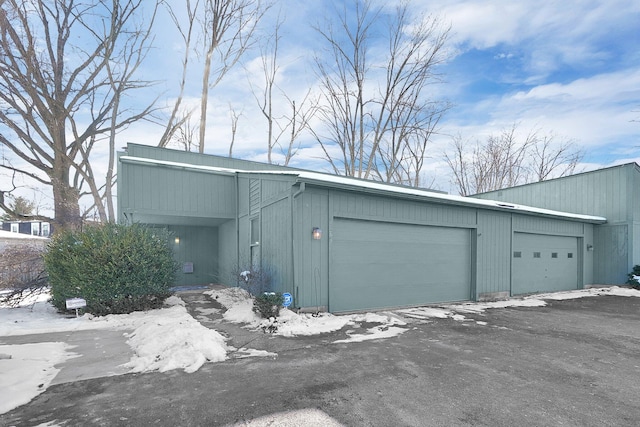 view of snow covered garage