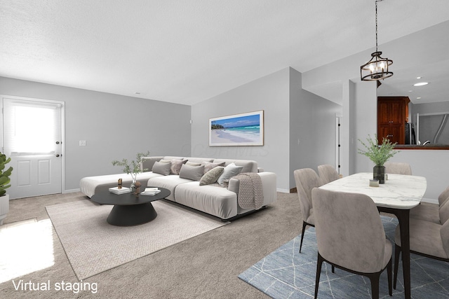 carpeted living room with vaulted ceiling