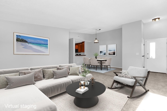 living room with lofted ceiling and carpet flooring