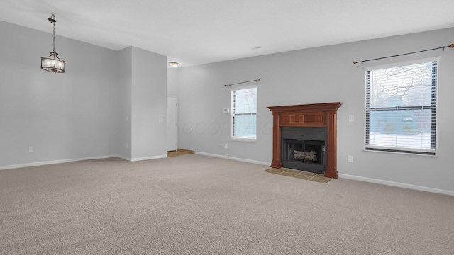 unfurnished living room with light carpet