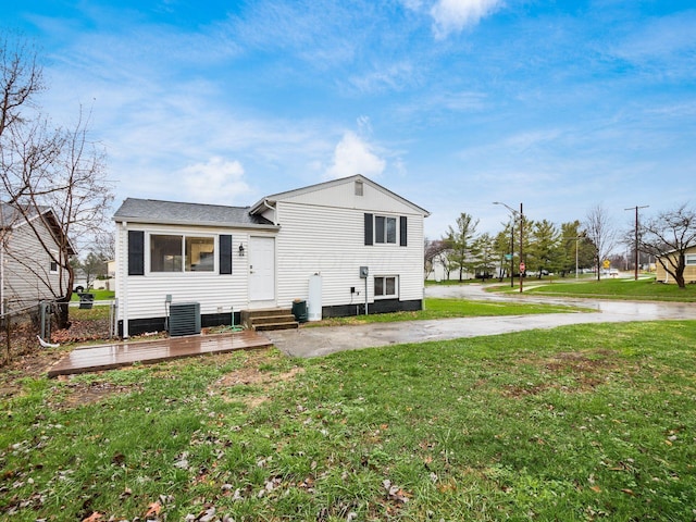 rear view of house with a lawn