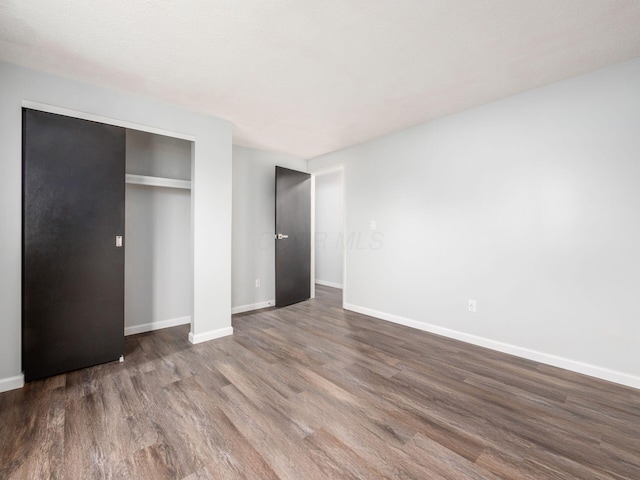 unfurnished bedroom featuring hardwood / wood-style floors