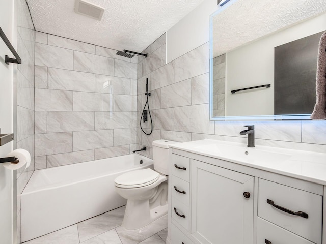 full bathroom featuring tiled shower / bath, decorative backsplash, toilet, tile walls, and a textured ceiling