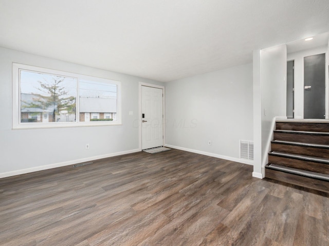 interior space with dark hardwood / wood-style flooring