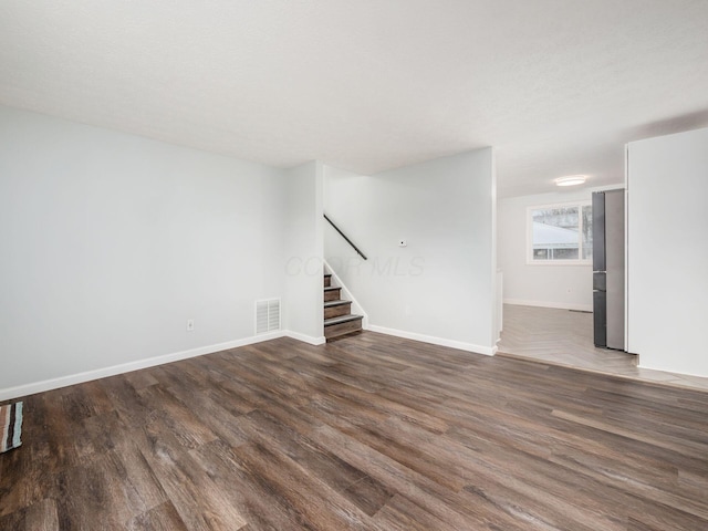 interior space with dark hardwood / wood-style floors