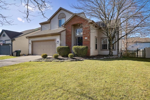 view of property with a front lawn and a garage