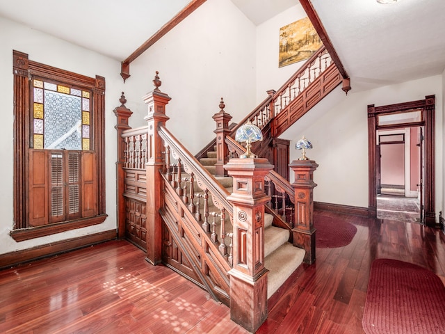 stairs featuring hardwood / wood-style flooring