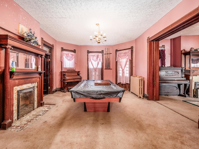 rec room featuring pool table, a textured ceiling, radiator, and light carpet