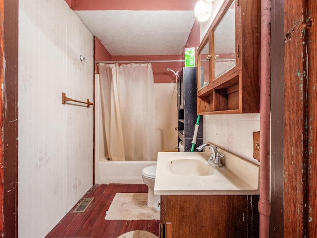 full bathroom featuring vanity, backsplash, hardwood / wood-style flooring, toilet, and shower / bathtub combination with curtain