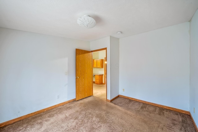 unfurnished room with carpet