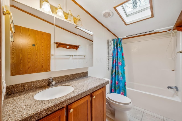 full bathroom featuring vanity, lofted ceiling with skylight, tile patterned flooring, toilet, and shower / tub combo with curtain