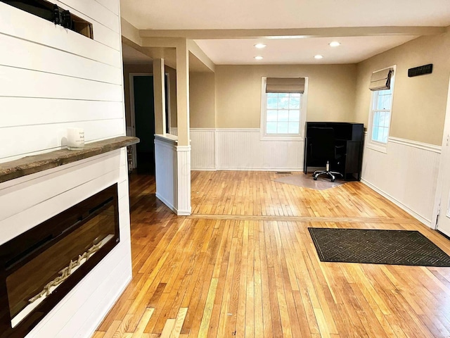 unfurnished living room with light hardwood / wood-style flooring