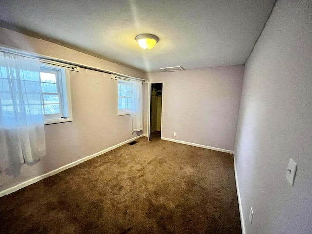 empty room with carpet flooring