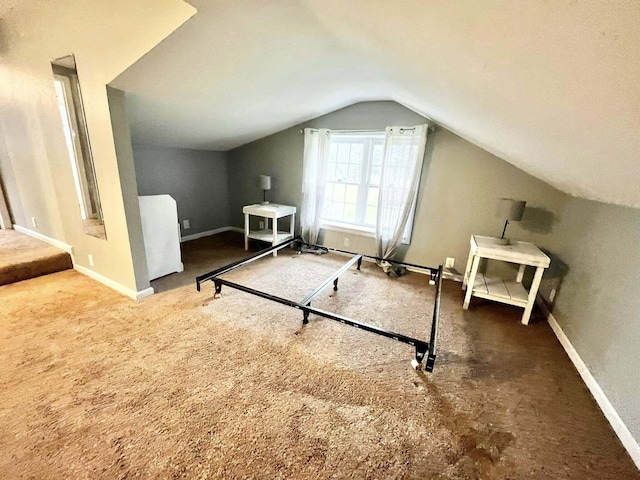 bonus room with carpet and vaulted ceiling