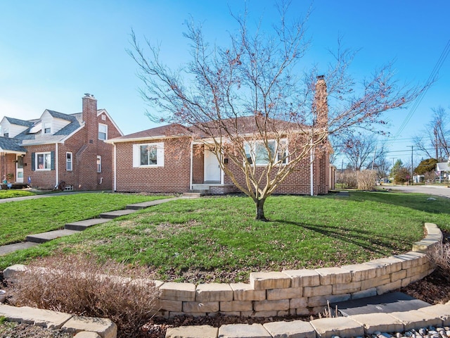 ranch-style house featuring a front lawn