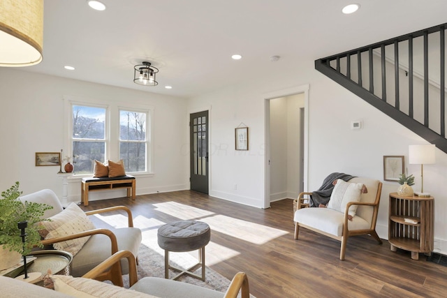 living room with dark hardwood / wood-style flooring