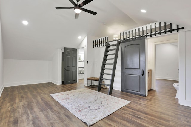 interior space featuring hardwood / wood-style flooring, ceiling fan, and vaulted ceiling