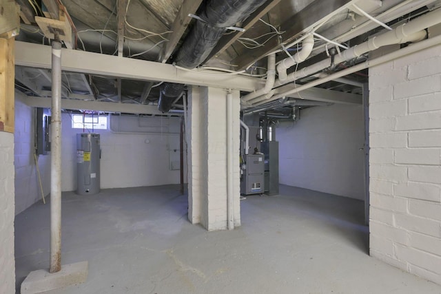 basement featuring heating unit and water heater