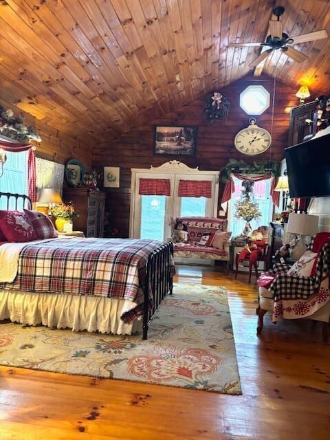 bedroom with wooden ceiling, hardwood / wood-style flooring, and lofted ceiling