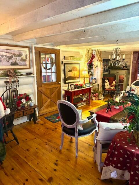 interior space with a chandelier and hardwood / wood-style flooring