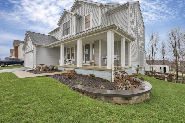 view of front of home featuring a porch, a garage, and a front lawn