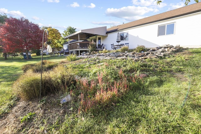 view of yard with a deck