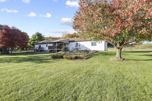 view of yard featuring a wooden deck