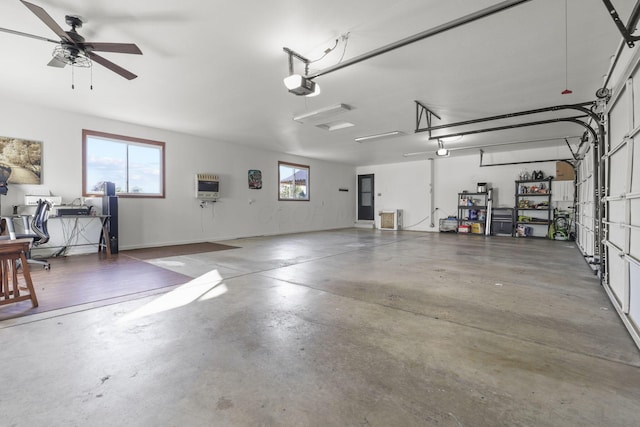 garage with heating unit, ceiling fan, and a garage door opener